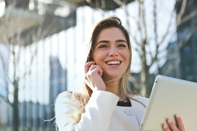 A person on a phone call smiling.